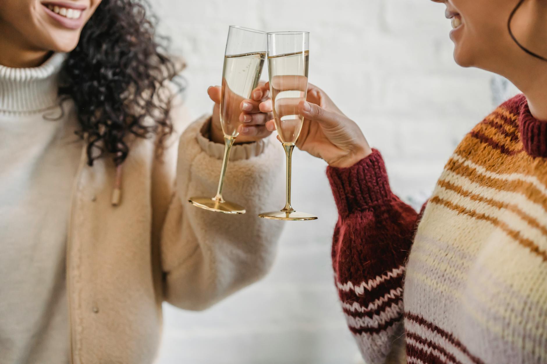 female friends celebrating holiday with champagne