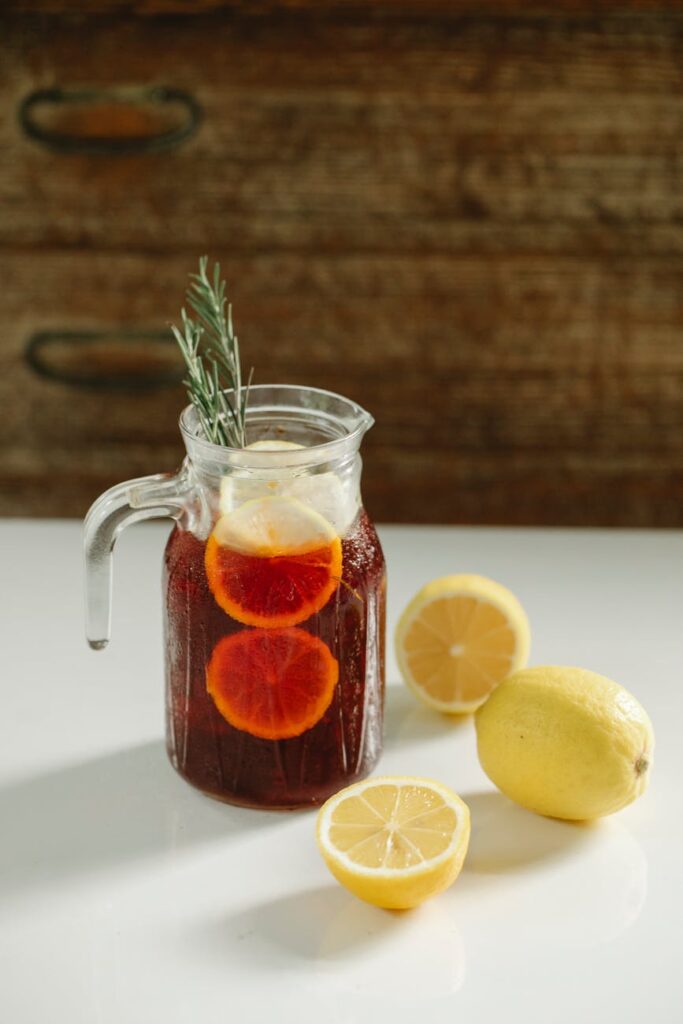 jag with refreshing drink with lemon on table