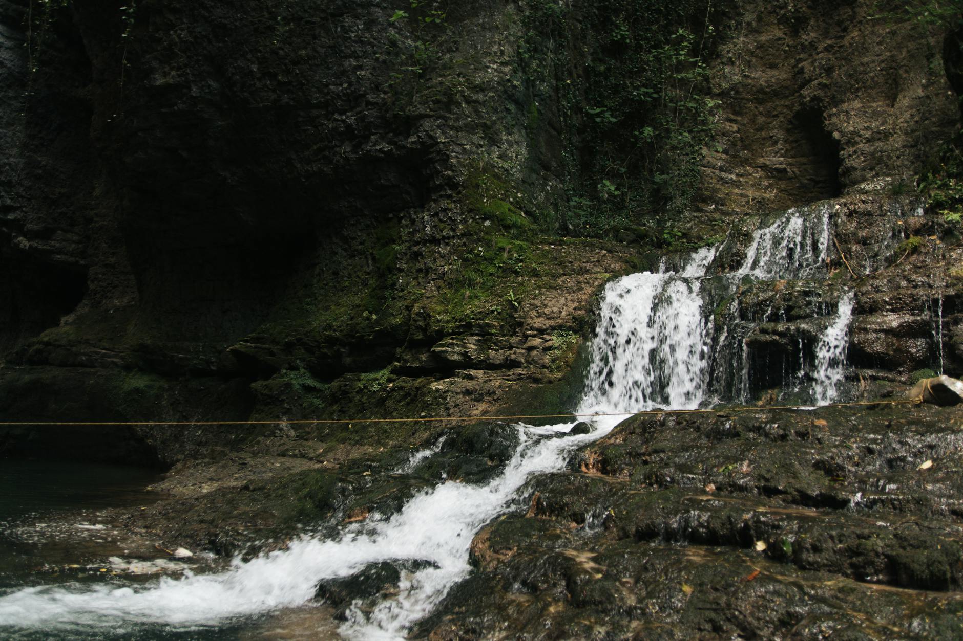 waterfalls in the middle of the forest