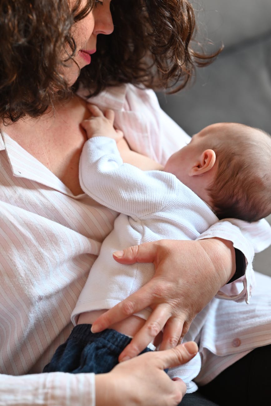 mother breastfeeding newborn