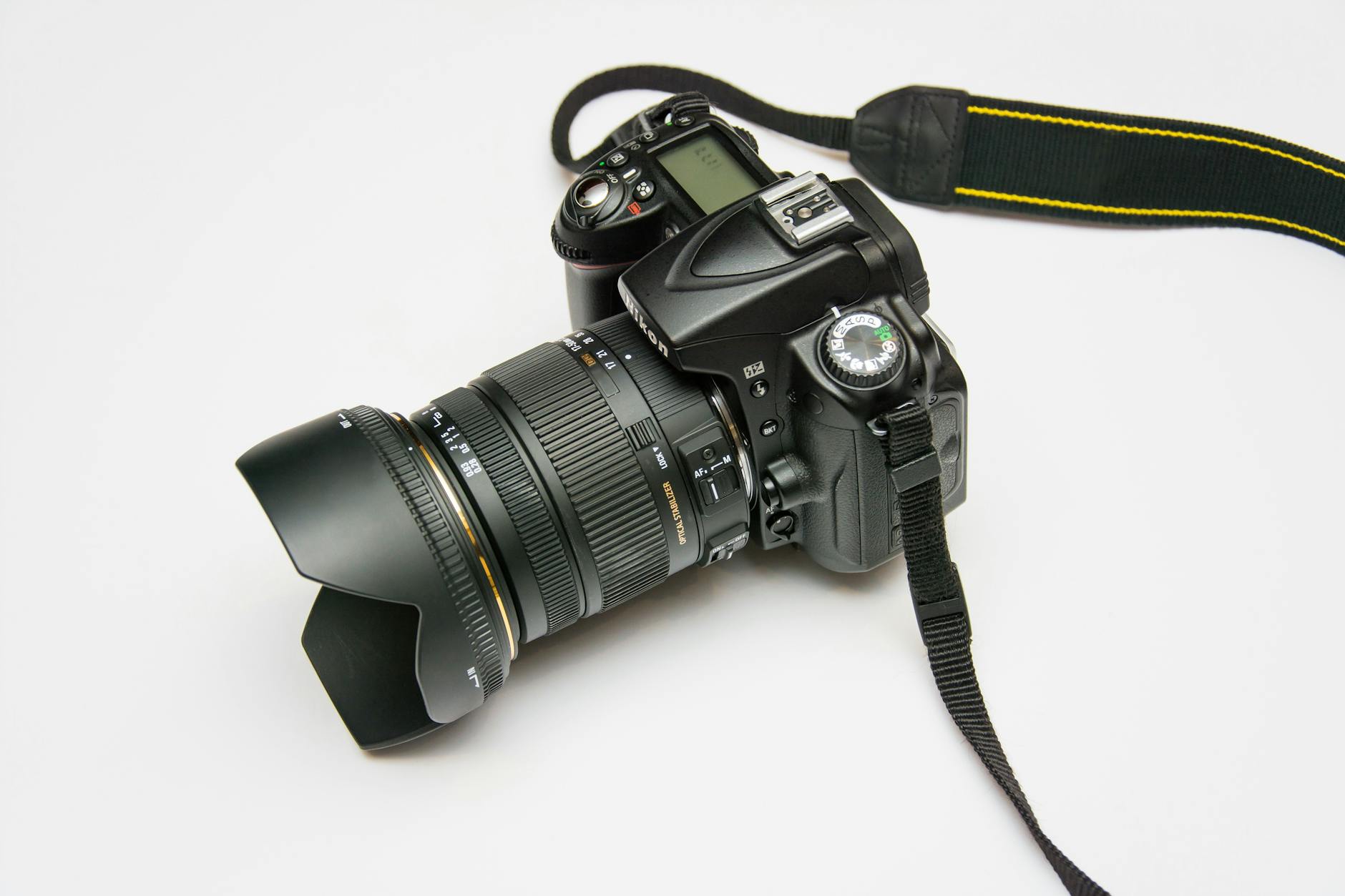 black dslr camera on white surface